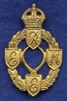 REME Badge designed in 1942. A laurel wreath surmounted by the King's crown; on the wreath, four shields with the letters R.E.M.E. Inside the wreath is a set of callipers. This bagde was in use from 1942 to 1947, until the modern 'Horse and Lightning' badge was adopted.