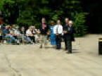 Presentation of Bronze Jerboa (Desert Rat) to Les Dinning by General Mullens to commemmorate founding of the Memorial. The Jerboa was donated by the 4th & 7th Armoured Brigades and mounted on a block of oak from Thetford Forest donated by Jim Lyon.