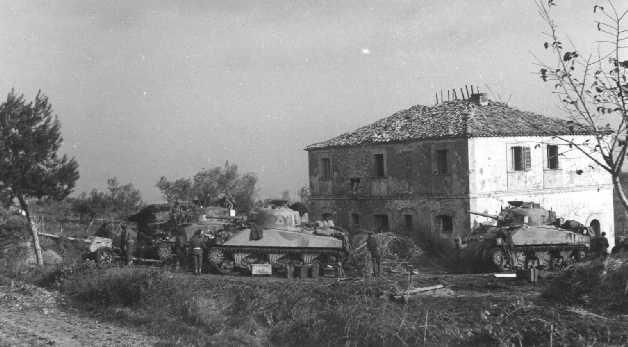 A Squadron, inspecting a German 75mm anti-tank gun between Santa Maria and Fossacesia, in November 1943