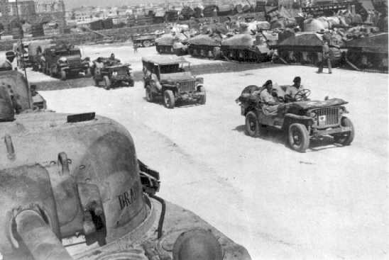 Preparing to embark at Catania for Italy - The Jeep carries AoS sign 86 with the new style Tac sign from the one on the Brigade HQ picture above.