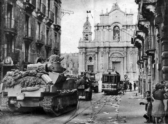 Sherman tanks of 'C' Squadron, 44th RTR, passing through Via Garibaldi, Catania