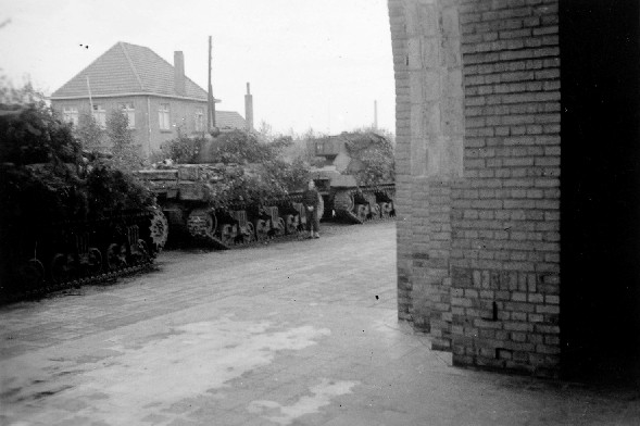 Well camouflaged Shermans in front of the church at Keent. Alas they are camouflaged for the countryside and not the town! Picture, courtesy of Tom Maton (4 RHA) and Wesley Haex.