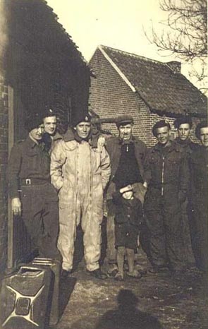 Men of 3rd/4th CLY (The Sharpshooters) with some villagers from Stamproy, Holland, December 1944.